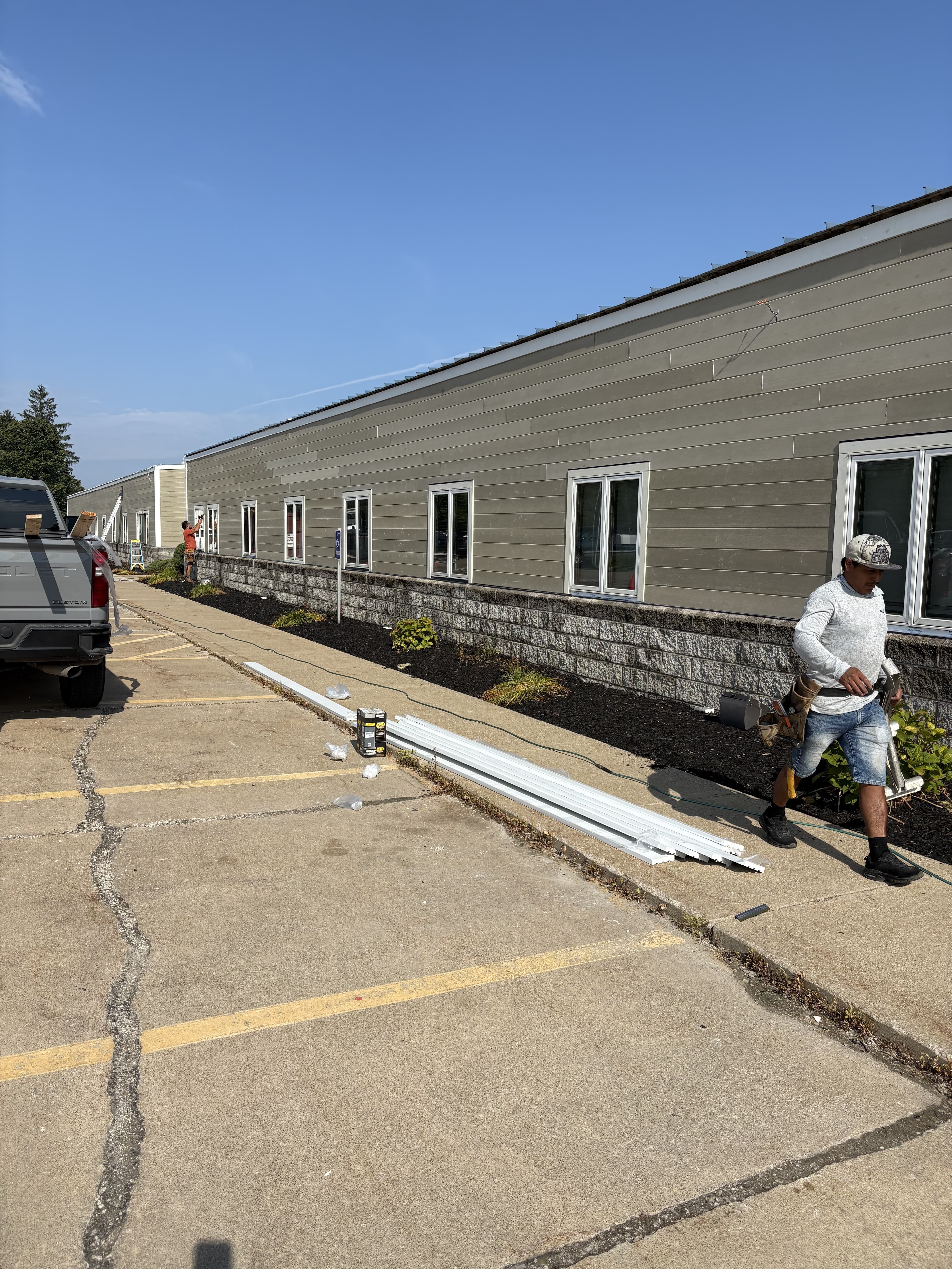 Long side elevation of a finished commercial building exterior.
