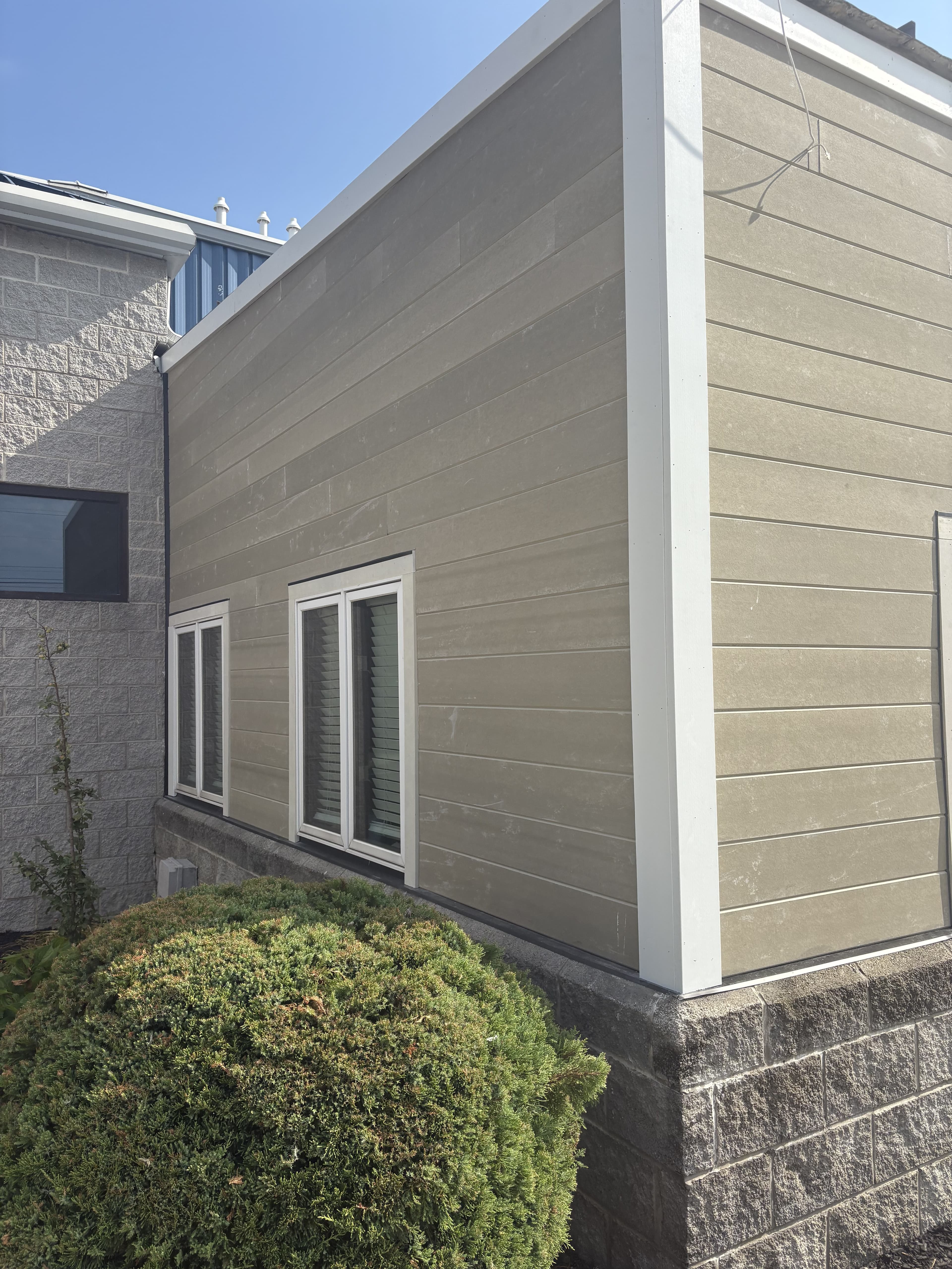 Close exterior siding detail on a commercial building.