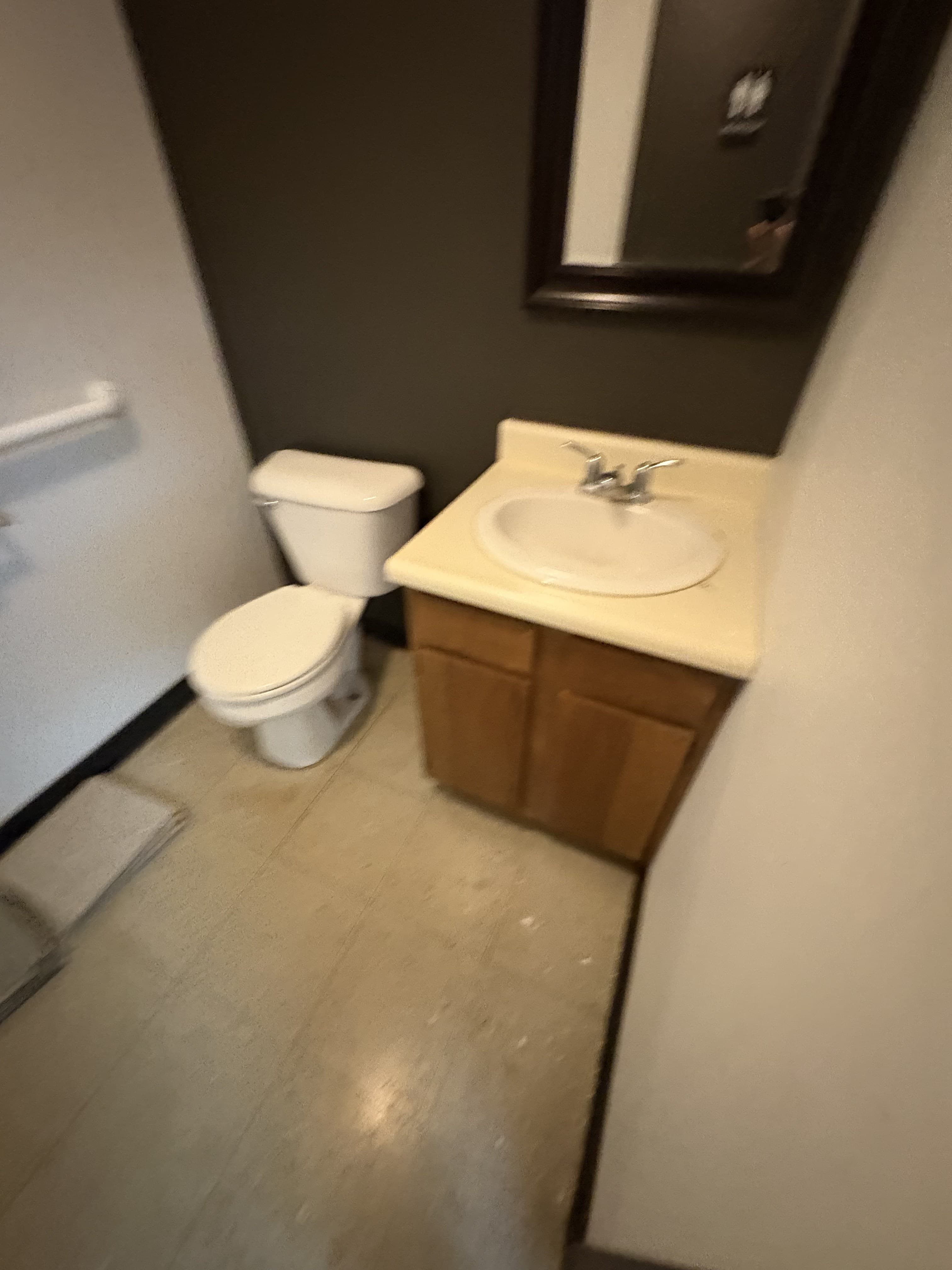 Commercial restroom entry and vanity area before demolition work begins.